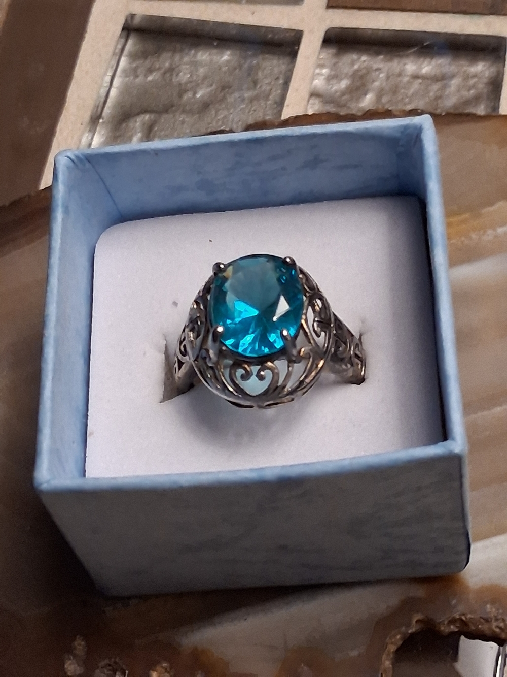 Sterling Silver Ring with Blue Gemstone and Filigree Accents